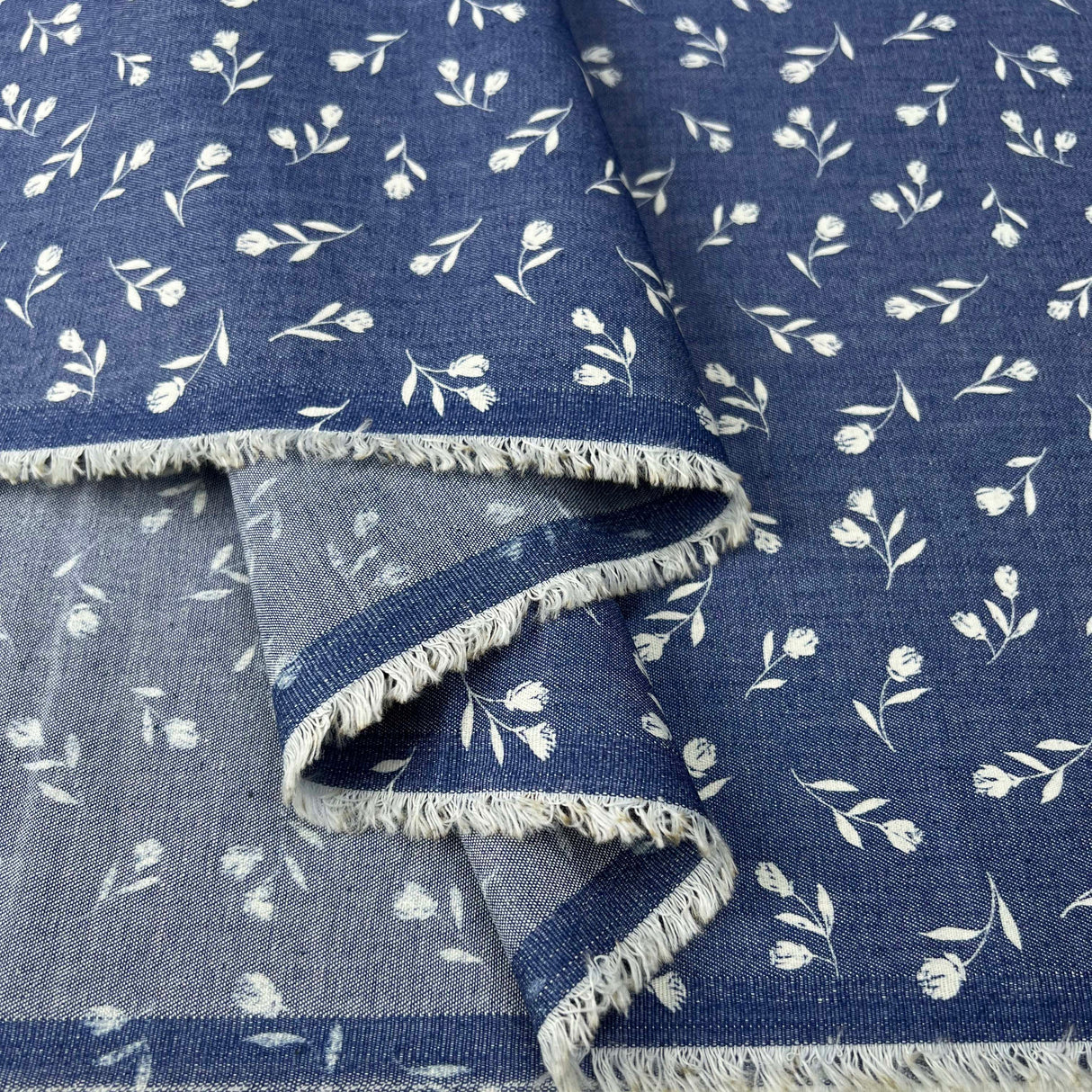 Heavenly Sprigs Cotton Denim Chambray Blue White Floral Print Lightweight Woven Dress Fabric Fold