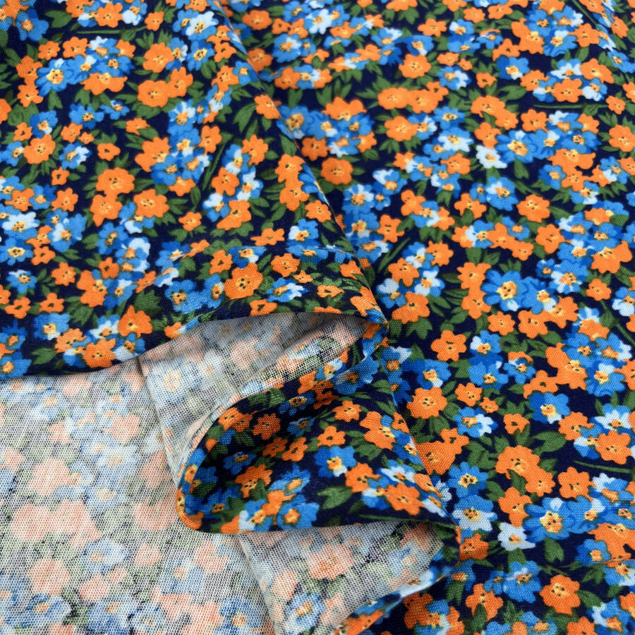 Austrian Jersey Sunset Floral Cotton Stretch Knit Orange Blue Dress Fabric Fold