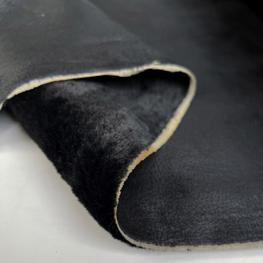 Corin Fur Backed Faux Leather Black Polyester Coating Fabric Fold