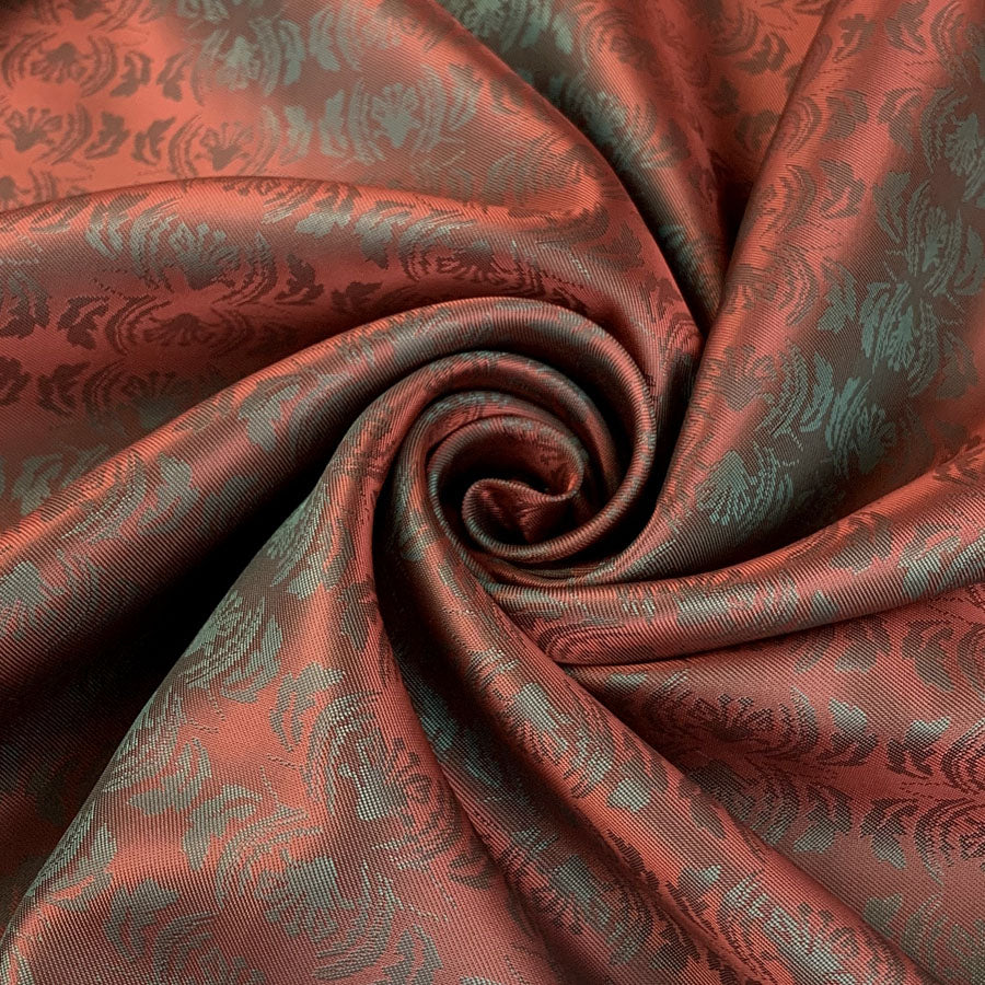 E210 Mirrored Red Pale Green Mirrored Leaf Design Pattern Lining Fabric Close Up Drape Fabric Photo