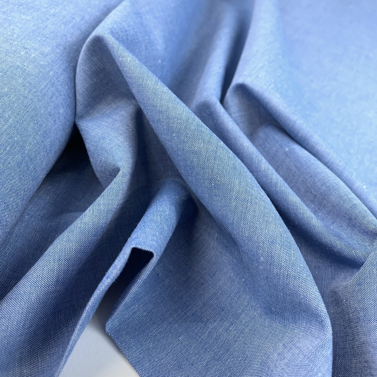 Finest Chambray Blue Lightweight Cotton Fabric Fold