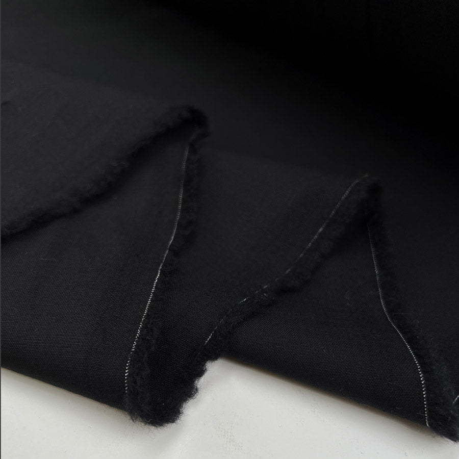 Fleece wool suiting black elastane stretch woven italian deadstock fabric fold