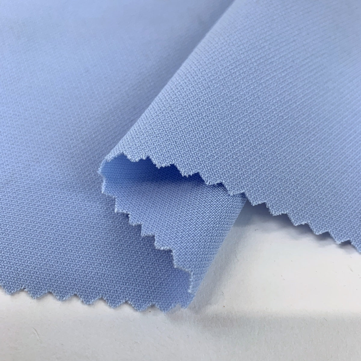 French Crepe Sky Bleu Pale Blue Polyester Crepe Suiting Fabric Fold