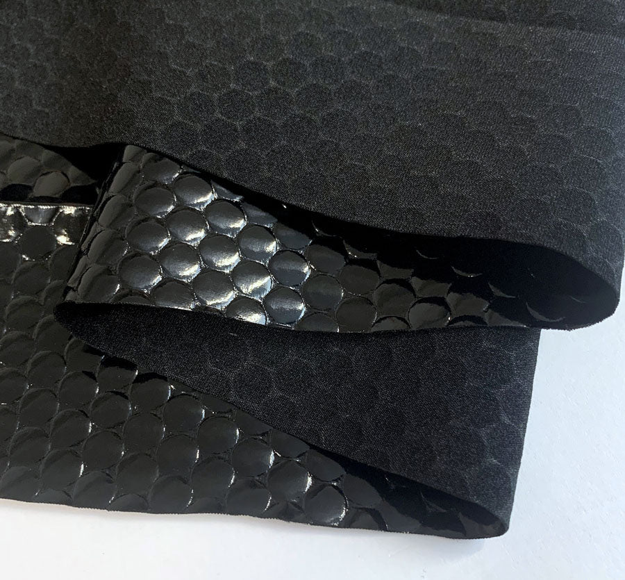 Hopelessly Devoted Knitted Coated Dotty Black Polyester Jersey Fabric Close Up Fabric Photo 1