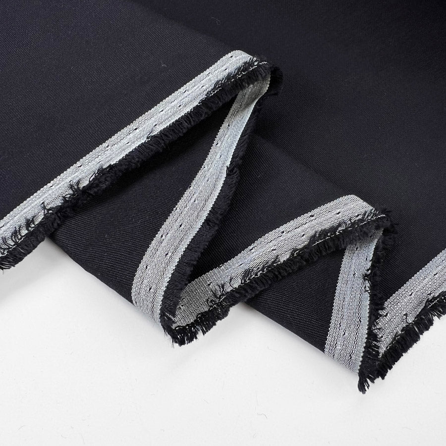 Italian cotton fine rib trousering fabric navy darkest hour fold