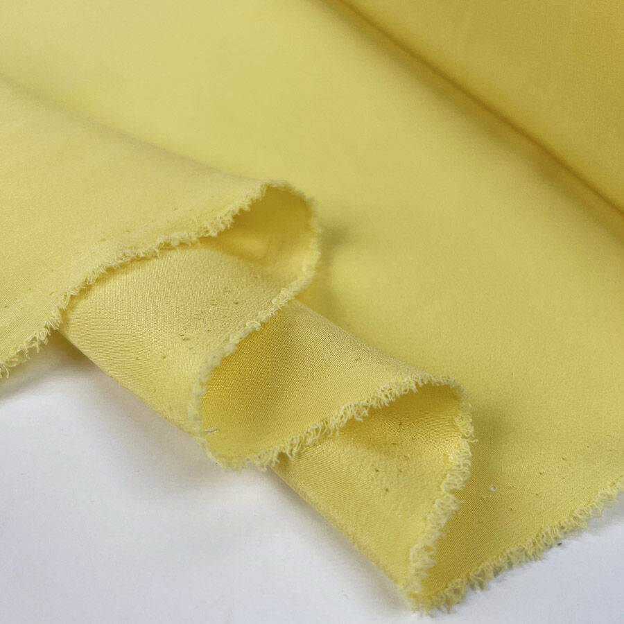 Limoncello silk yellow plain woven italian lightweight dress fabric fold
