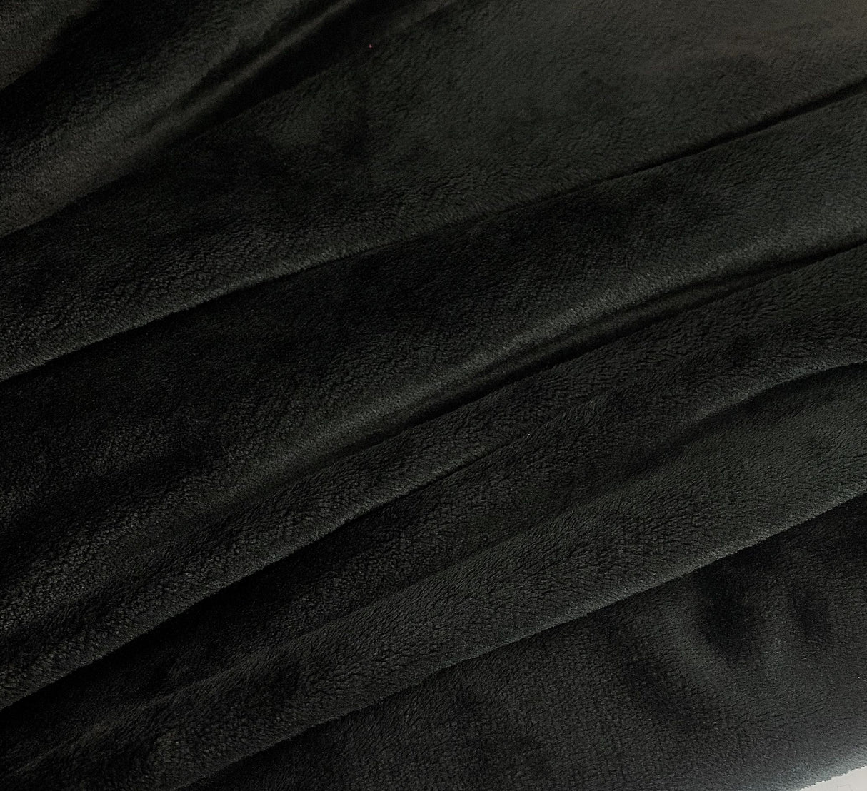 Lucious Fleece Black Colourful Soft Polyester Cuddly Fleece Fabric Close Up Fabric Photo