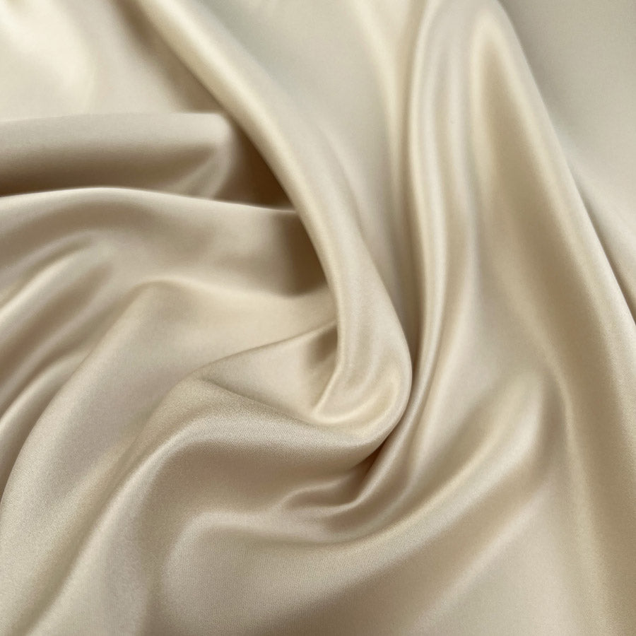 Mystique Champagne Polyester Matte Satin Gold Plain Woven Dress Fabric