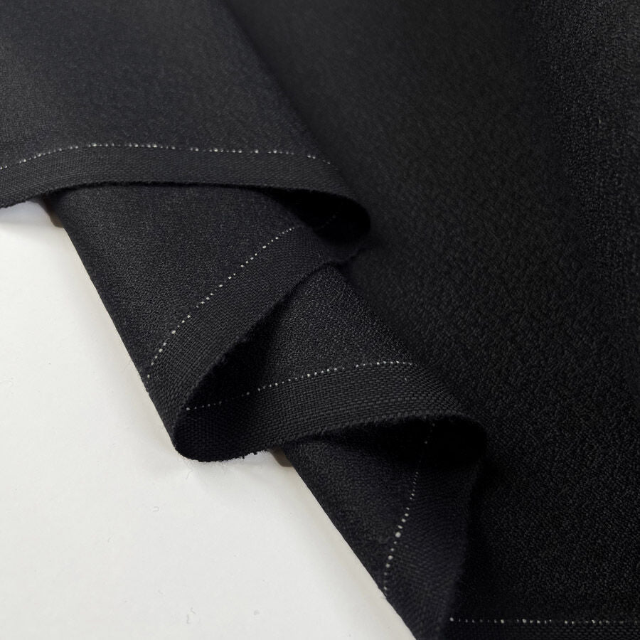 Night Rider Black Wool Italian Fine Suiting Fabric Fold