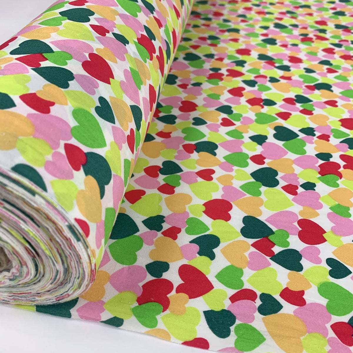 Poplin Print Colourful Hearts Green Multi Coloured Hearts On A White Ground Roll