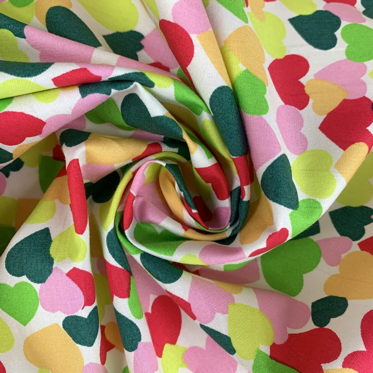 Poplin Print Colourful Hearts Green Multi Coloured Hearts On A White Ground Swirl