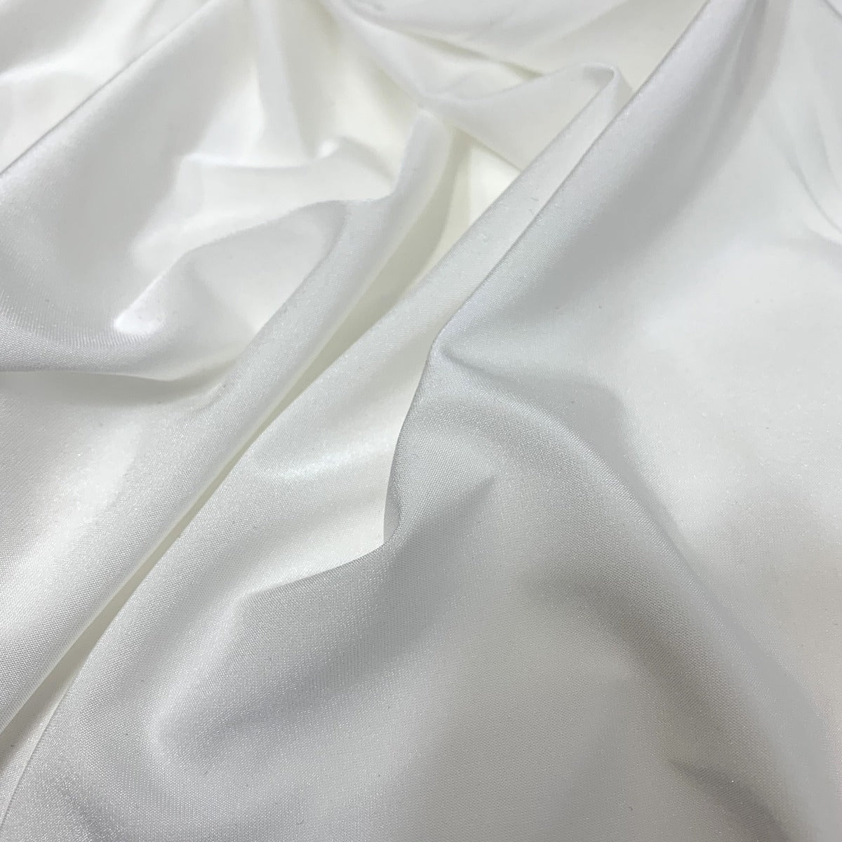 Sheen White Stretchy Knitted Jersey White Dress Lining Fold