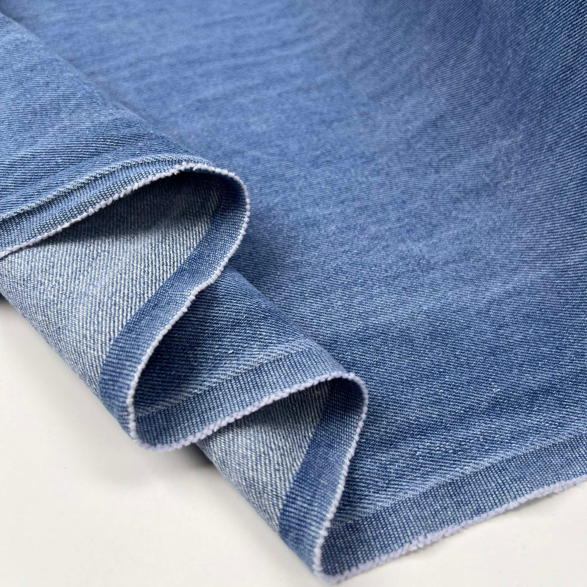 10oz Washed Denim Archie Cotton Blue Sky Plain Woven Jean Trouser Fabric Fold