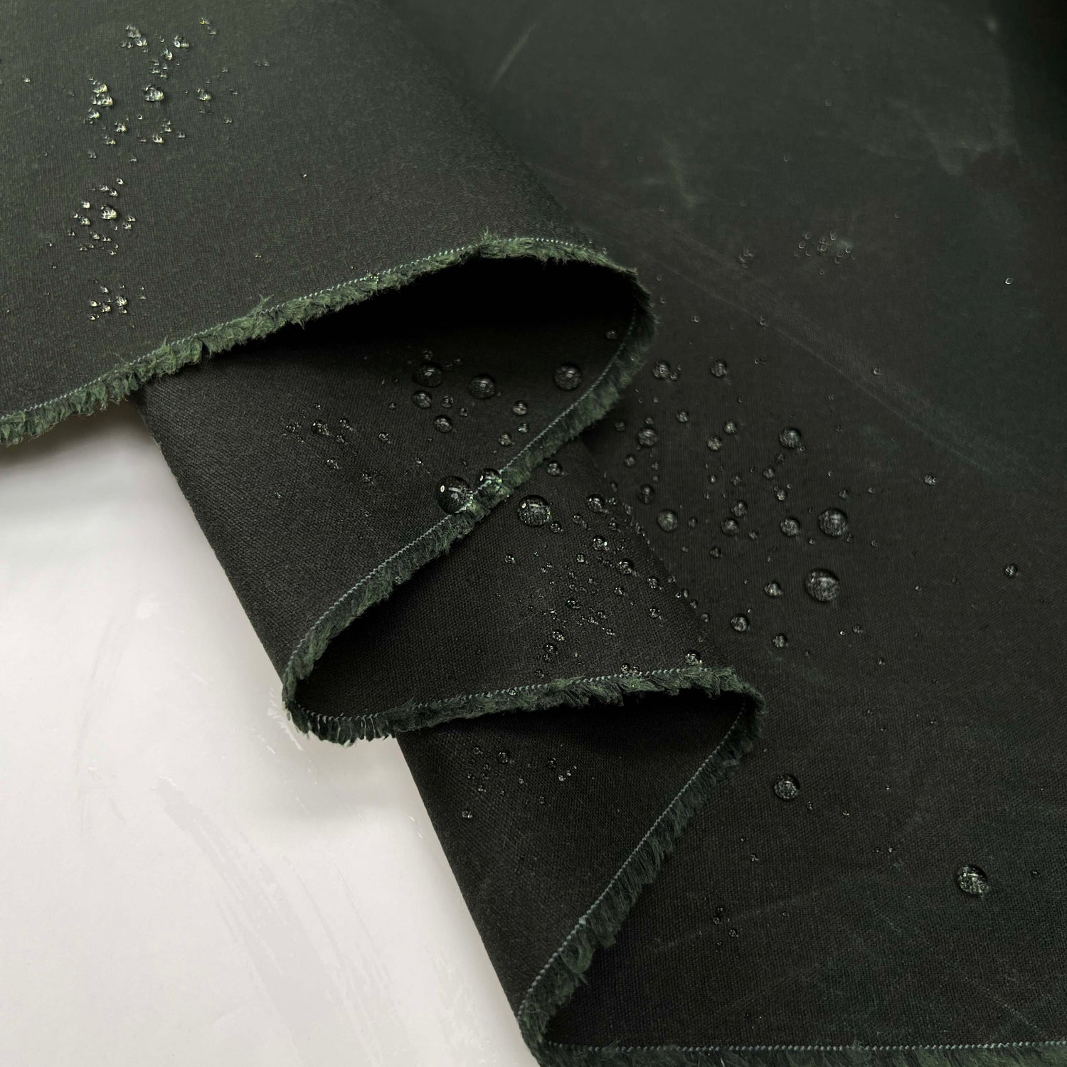 12oz_Waxed_Cotton_Bottle_British_Water_Resistant_Coating_Fabric_Close_up_Splash