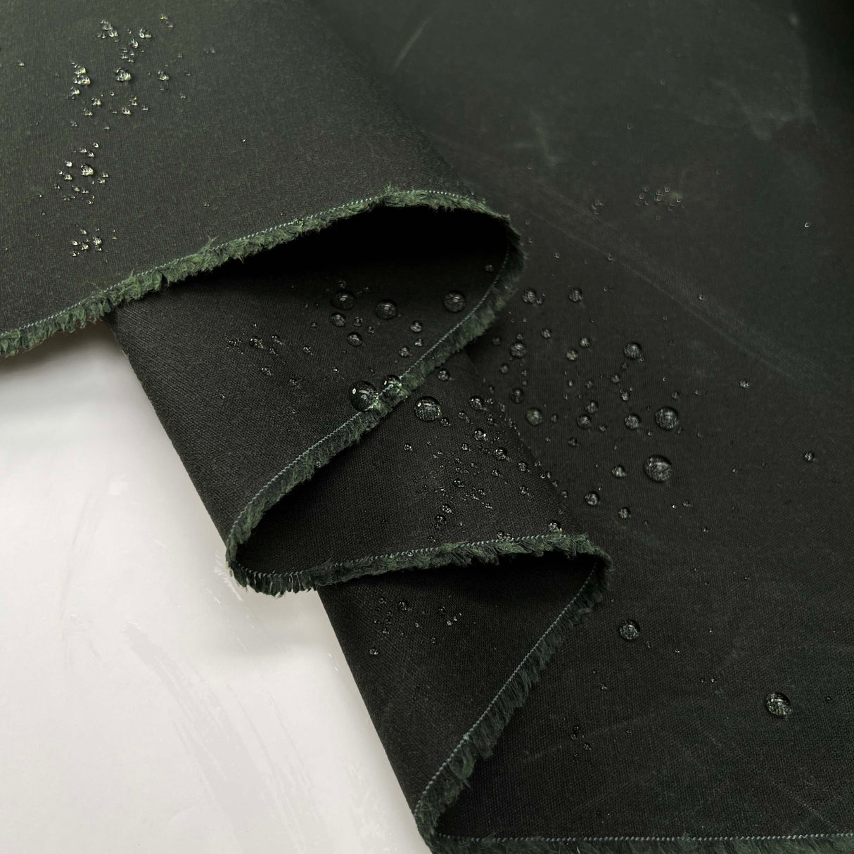 12oz_Waxed_Cotton_Bottle_British_Water_Resistant_Coating_Fabric_Close_up_Splash