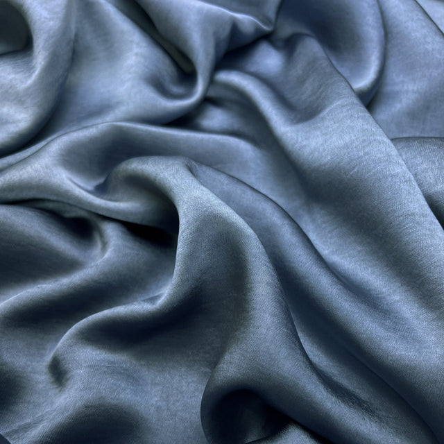 Bella Satin Stretch Petrol Blue Polyester Elastane Smooth Dressmaking Fabric Close up