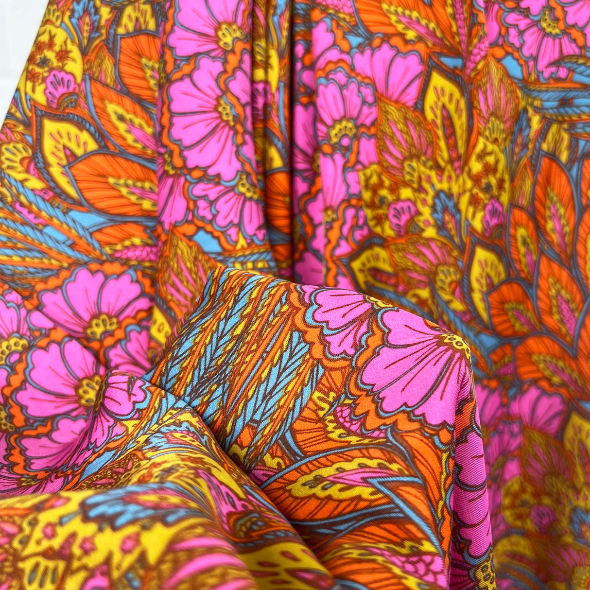 Bold Floral Paisley Orange and Pink Viscose Abstract Dress Fabric Close Up