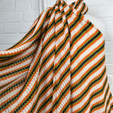 Polycotton Orange green Striped Crochet Fabric Cadiz - Cinnamon Stripe mannequin