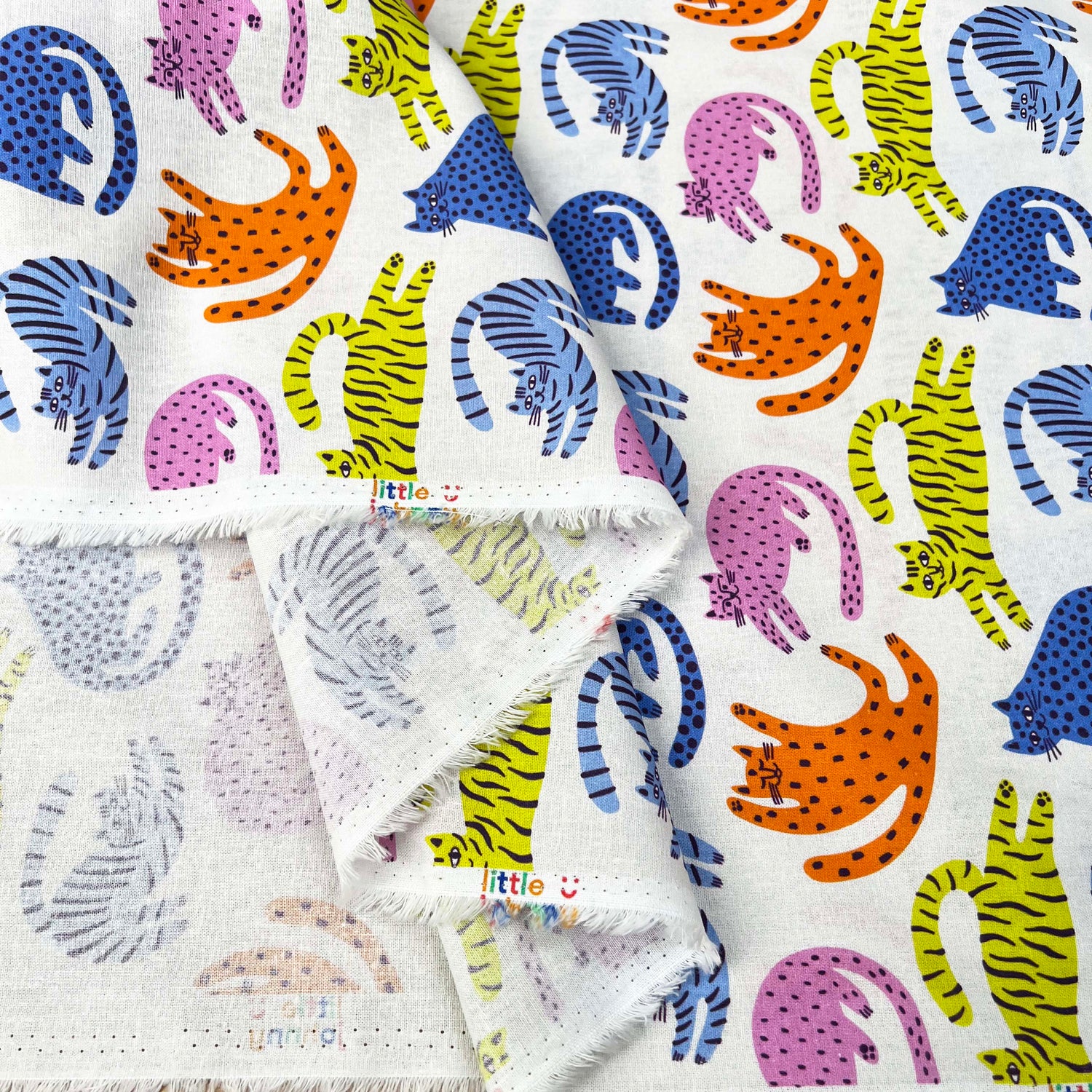 Cotton Print Lazy Cats White Multicoloured Animal Print Fabric Fold