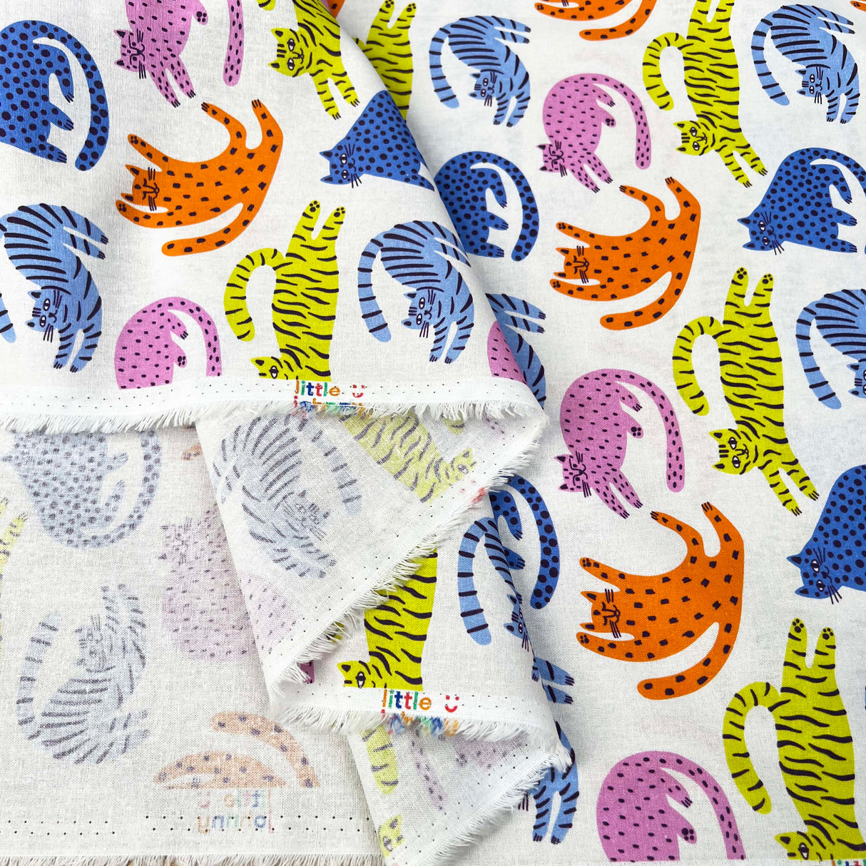 Cotton Print Lazy Cats White Multicoloured Animal Print Fabric Fold