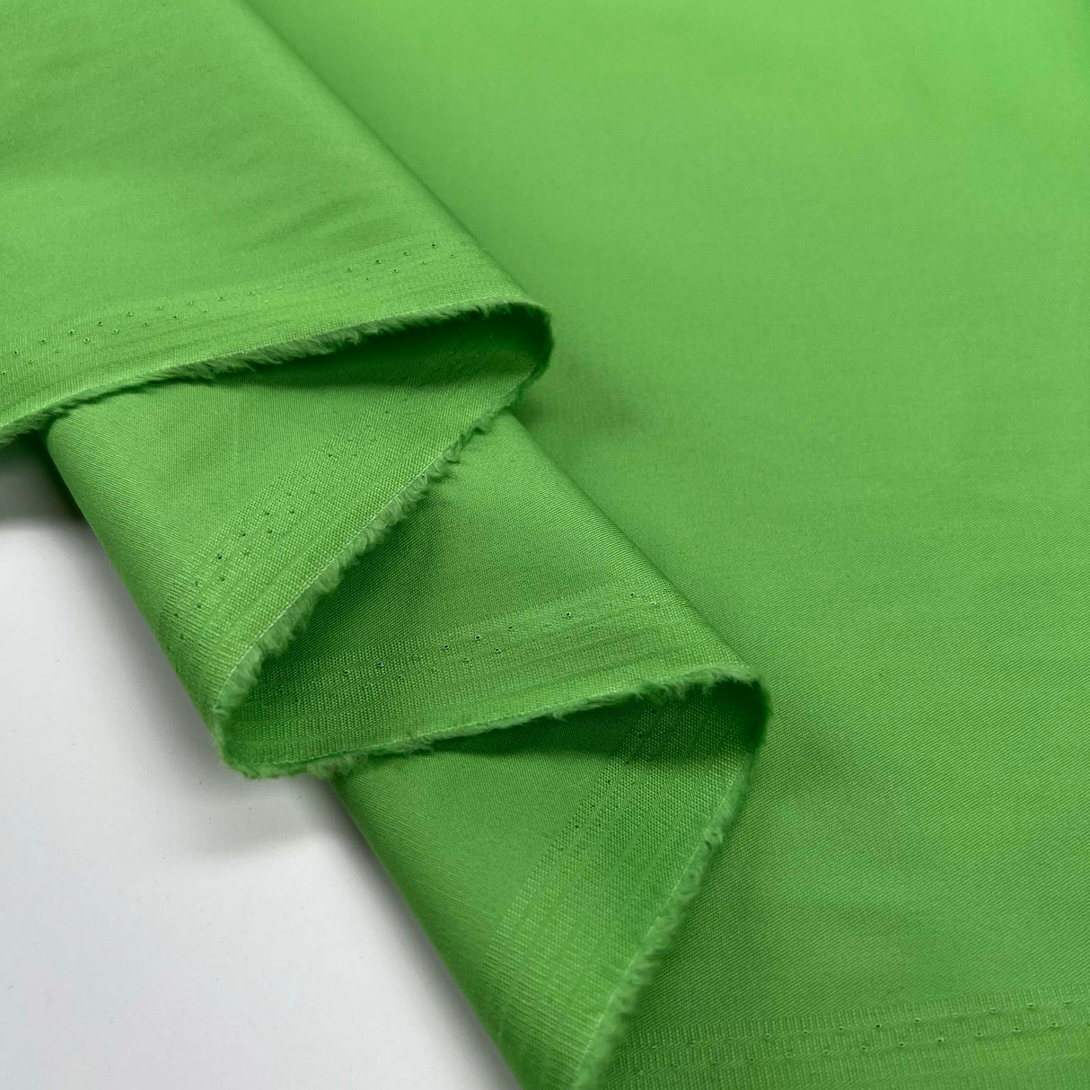 Cotton Unito Green Plain Woven Italian Fabric Fold