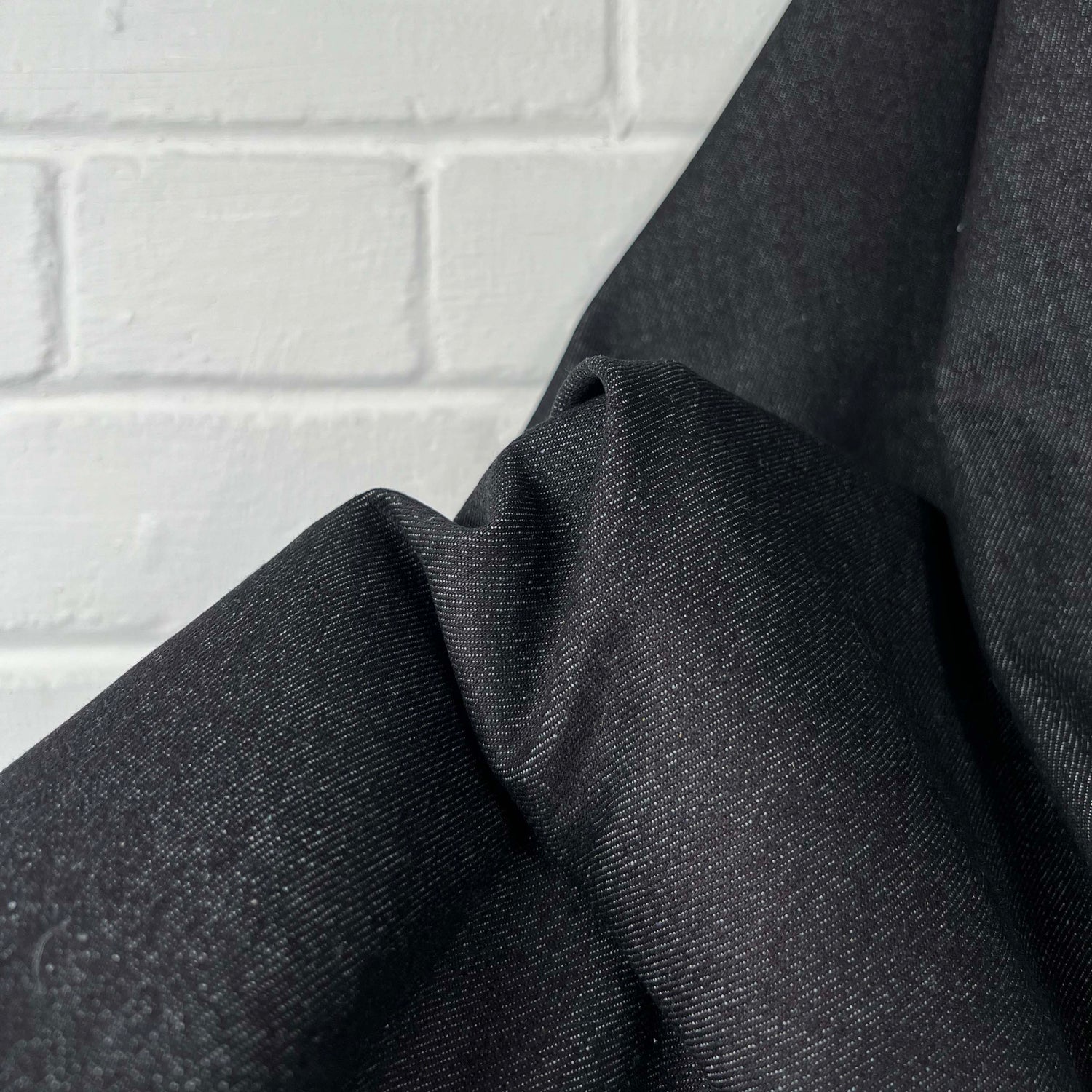 Denimfest 9.6oz Daniel Black Cotton Midweight Woven Jean Trouser Fabric hand