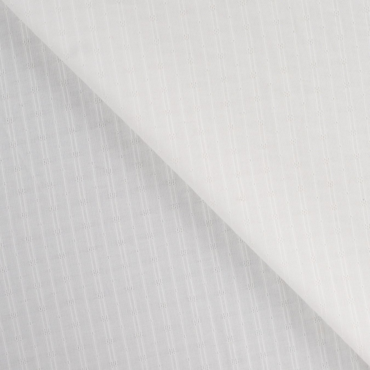 Dot & Stripe Soft White Dobby Cotton 95gsm Dress Fabric Fold