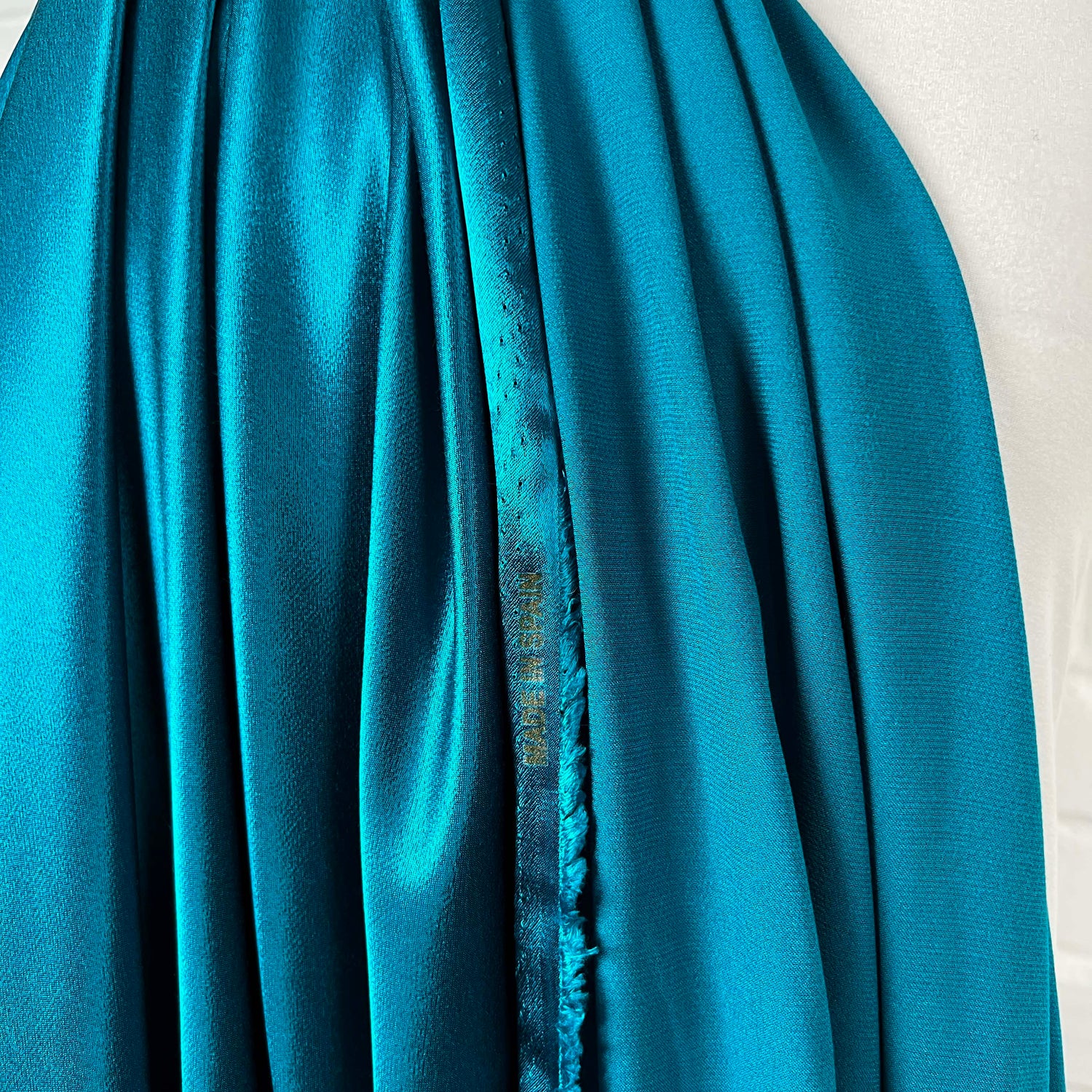 Eternal Satin Turquoise Viscose Italian Dress Fabric Hang