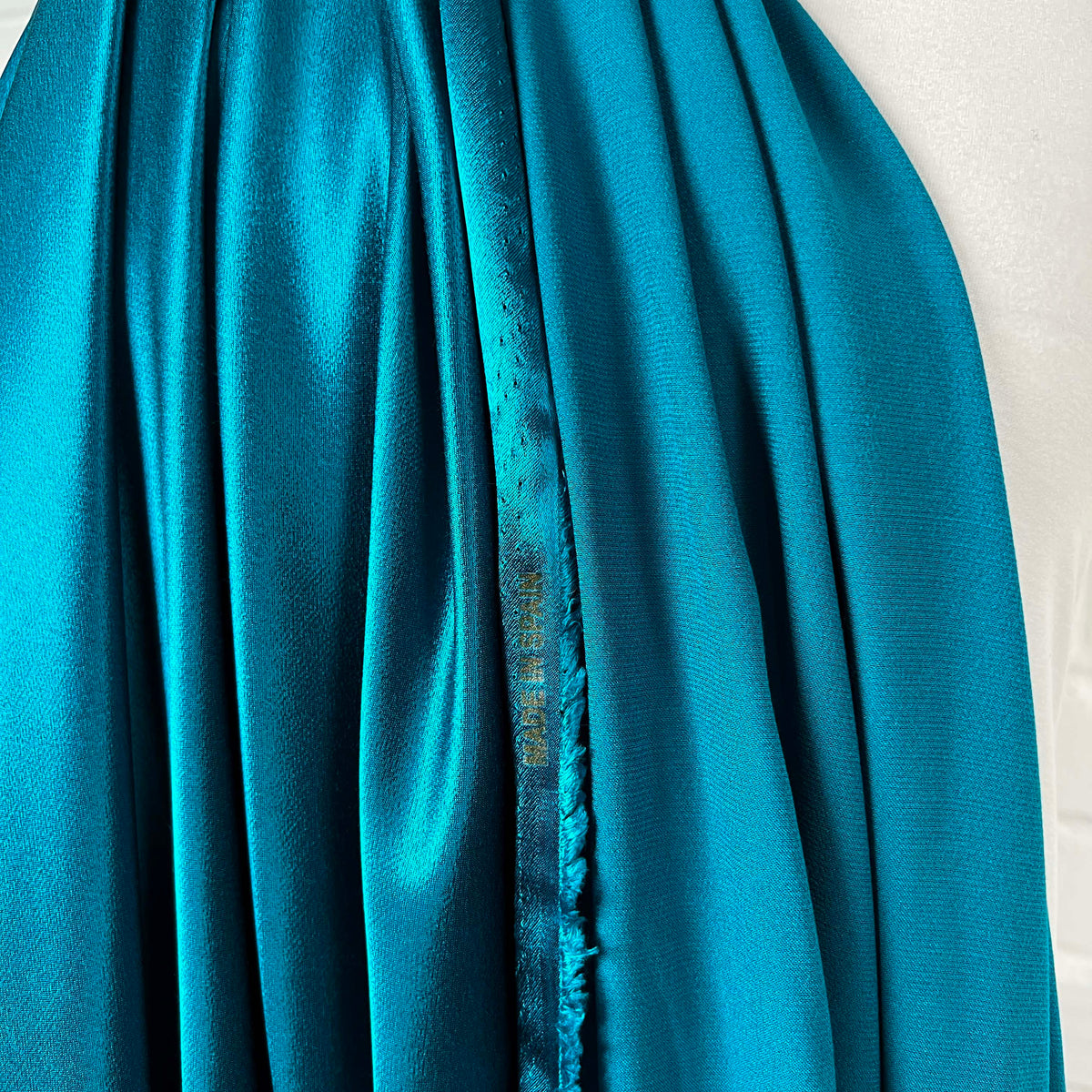 Eternal Satin Turquoise Viscose Italian Dress Fabric Hang