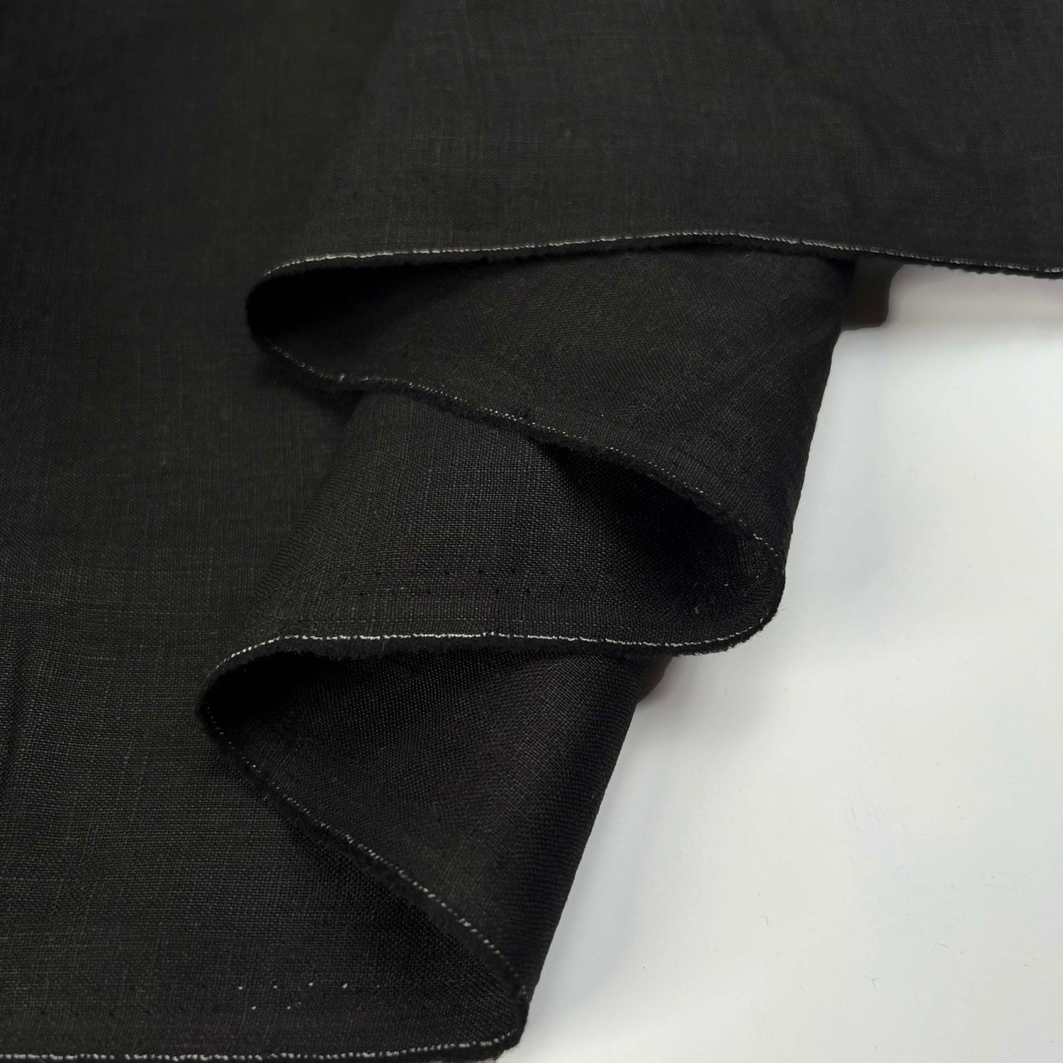 French_Linen_Black_Plain_Woven_Dress_Fabric_Fold