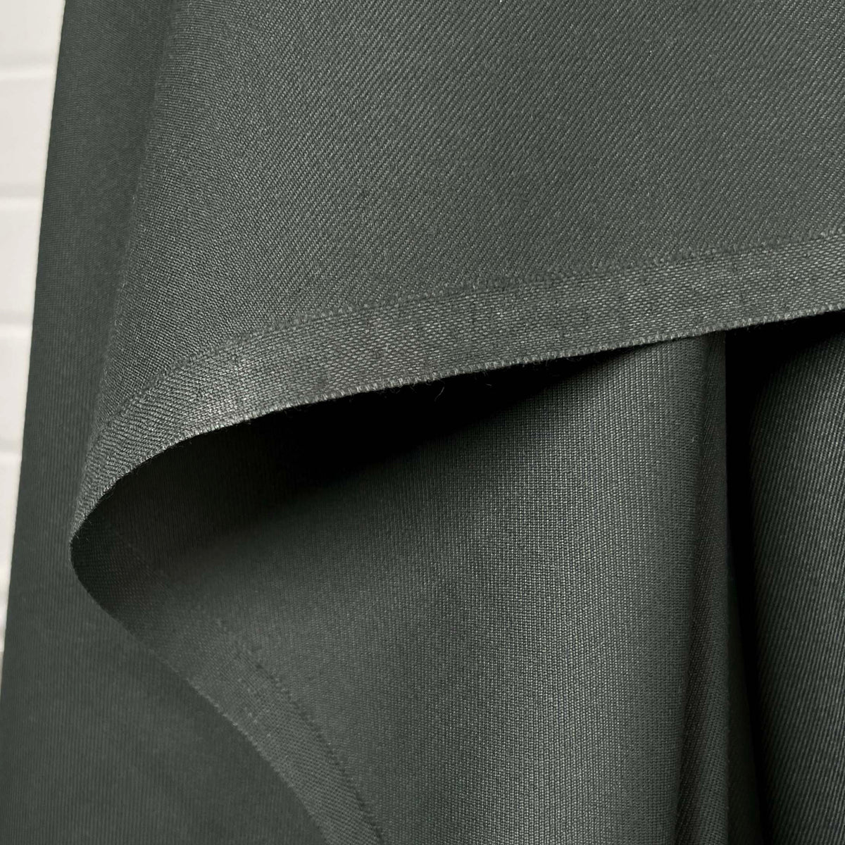 Gambrella Polyester Wool Green Fine Twill Suiting Fabric Hang