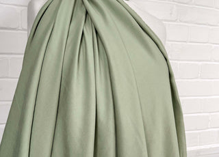 Gentle Green Modal Recycled Polyester Dress Fabric Mannequin