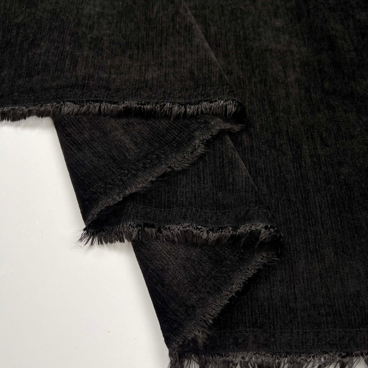 Have Mercy Polyester Spandex Black Velveteen John Louden Soft Jacketing Fabric Fold