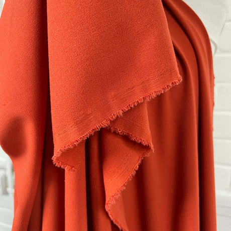 Soft Textured Stretch Dressmaking Fabric | Italian Crepe - Rust Hang