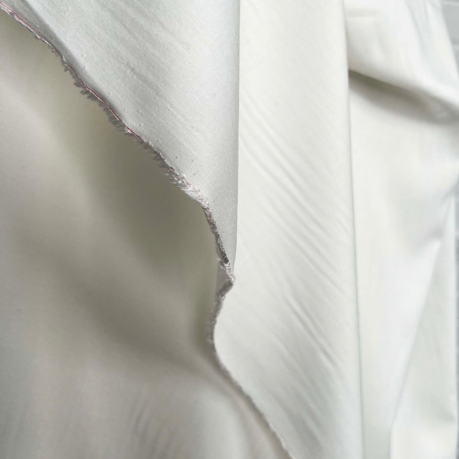 La Dolce Viscose Plain Woven Cream Ex Designer Deadstock Shirting Fabric Fold