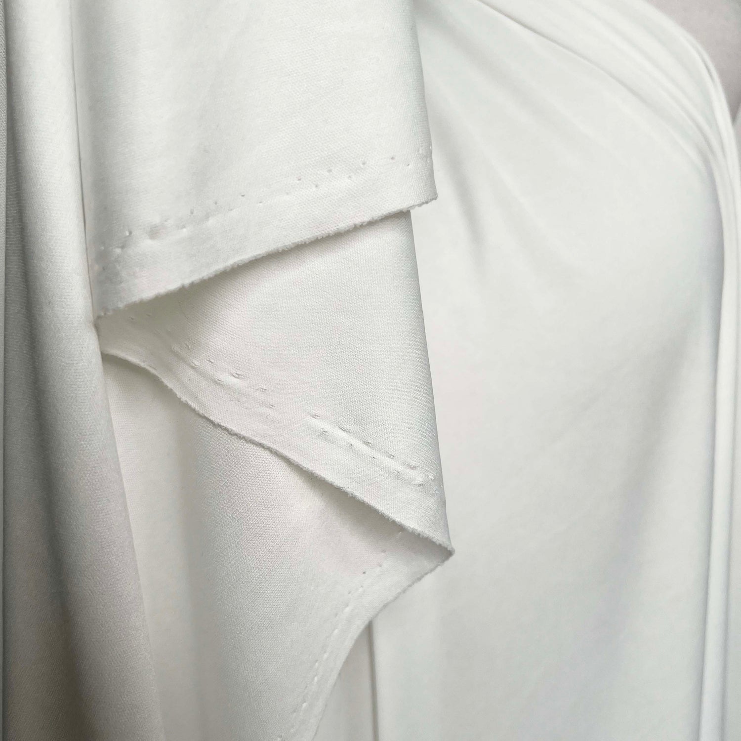 White Fine Nylon Jersey Dressmaking Fabric Marshmallow Dreams Hang