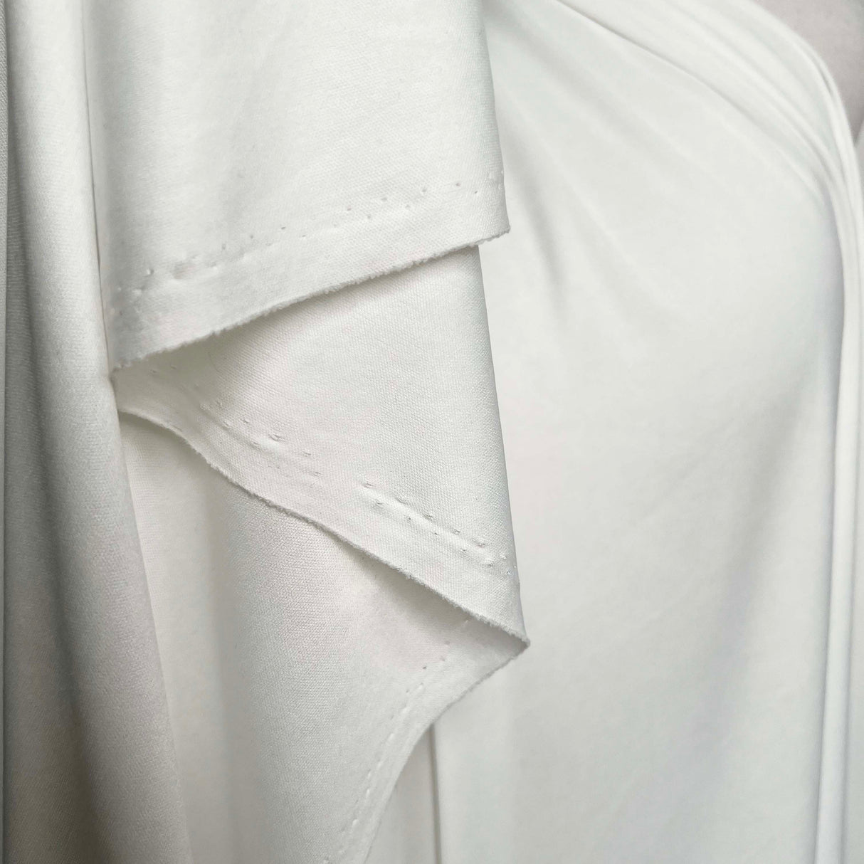 White Fine Nylon Jersey Dressmaking Fabric Marshmallow Dreams Hang