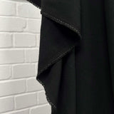 Moving Well Polyester Wool Elastane Black Midweight Portuguese Suiting Fabric Hang