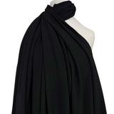 Moving Well Polyester Wool Elastane Black Midweight Portuguese Suiting Fabric Mannequin