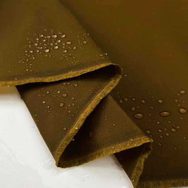 Oil_Finish_Tin_Cloth_Tan_Waxed_Cotton_Water_Resistant_British_Coating_Fabric_Fold_Splash