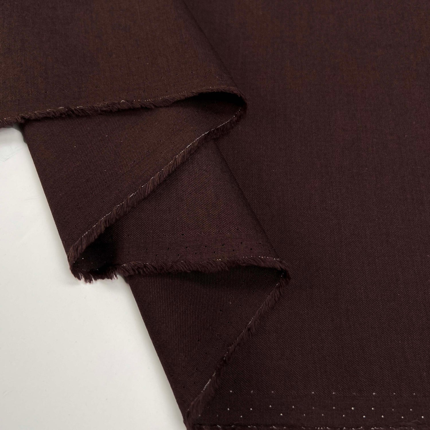 Plum Duff Wool Cotton Damson Plain Woven Suiting Fabric Fold