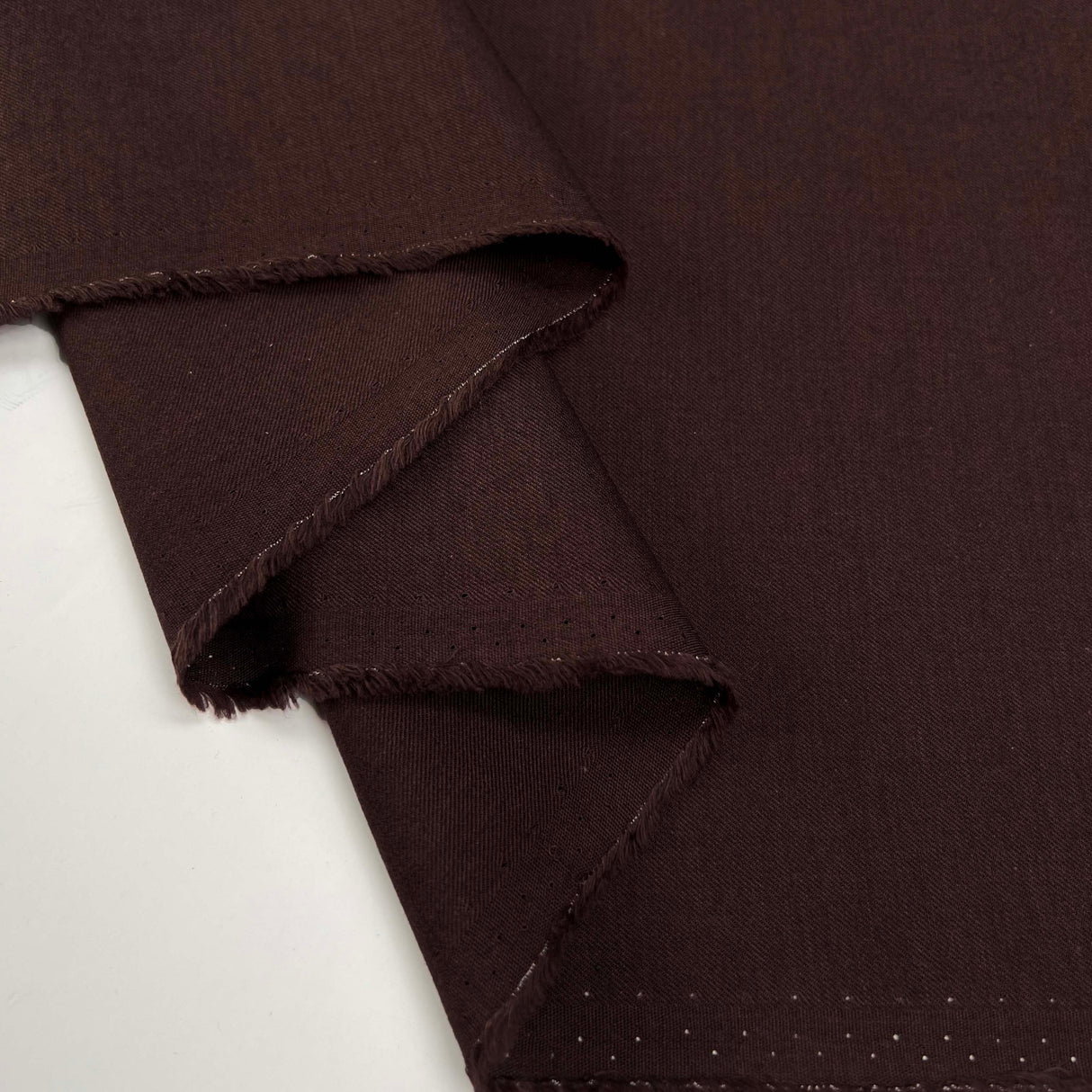 Plum Duff Wool Cotton Damson Plain Woven Suiting Fabric Fold