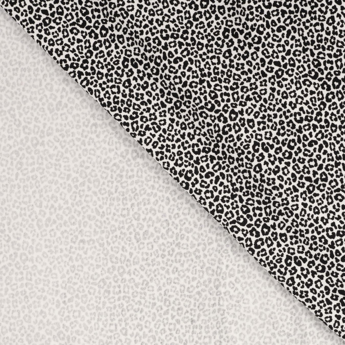Pocket Panther Ecru Animal Print Knitted Cotton Jersey 200gsm Dress Fabric Fold