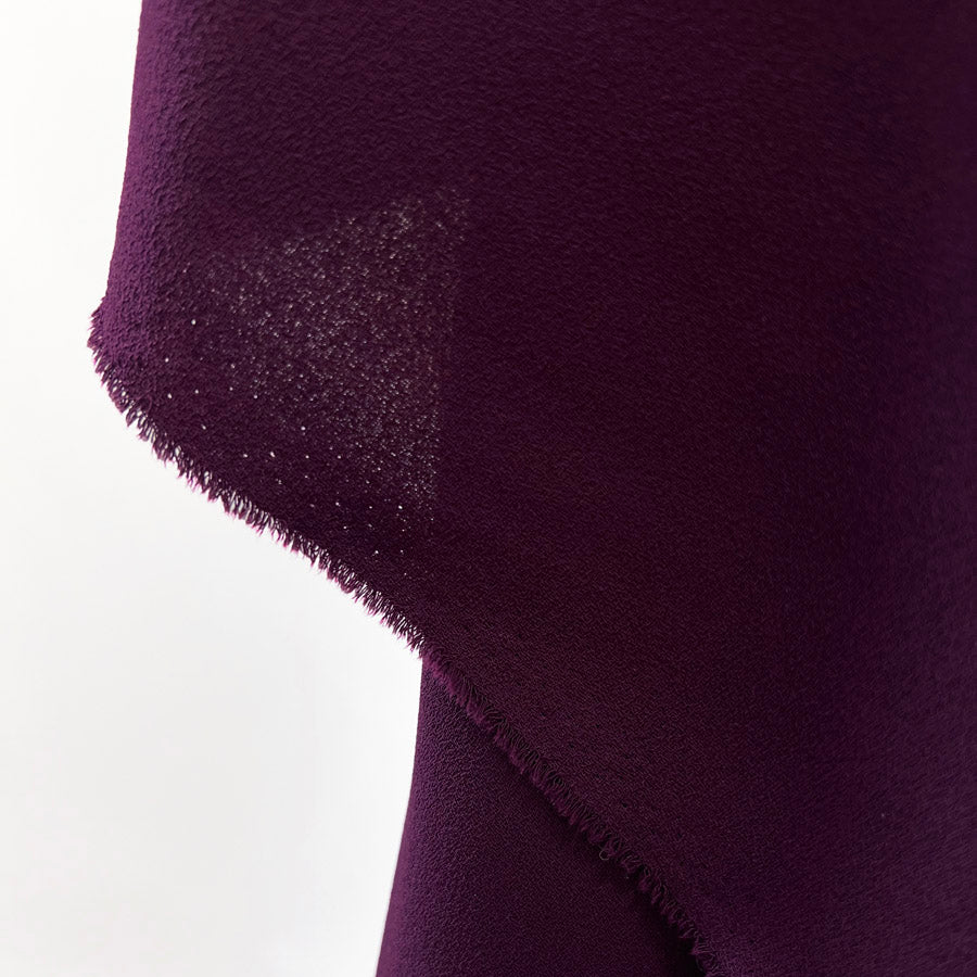 Polyester Triple Crepe Dressmaking Fabric Dark Plum Hang