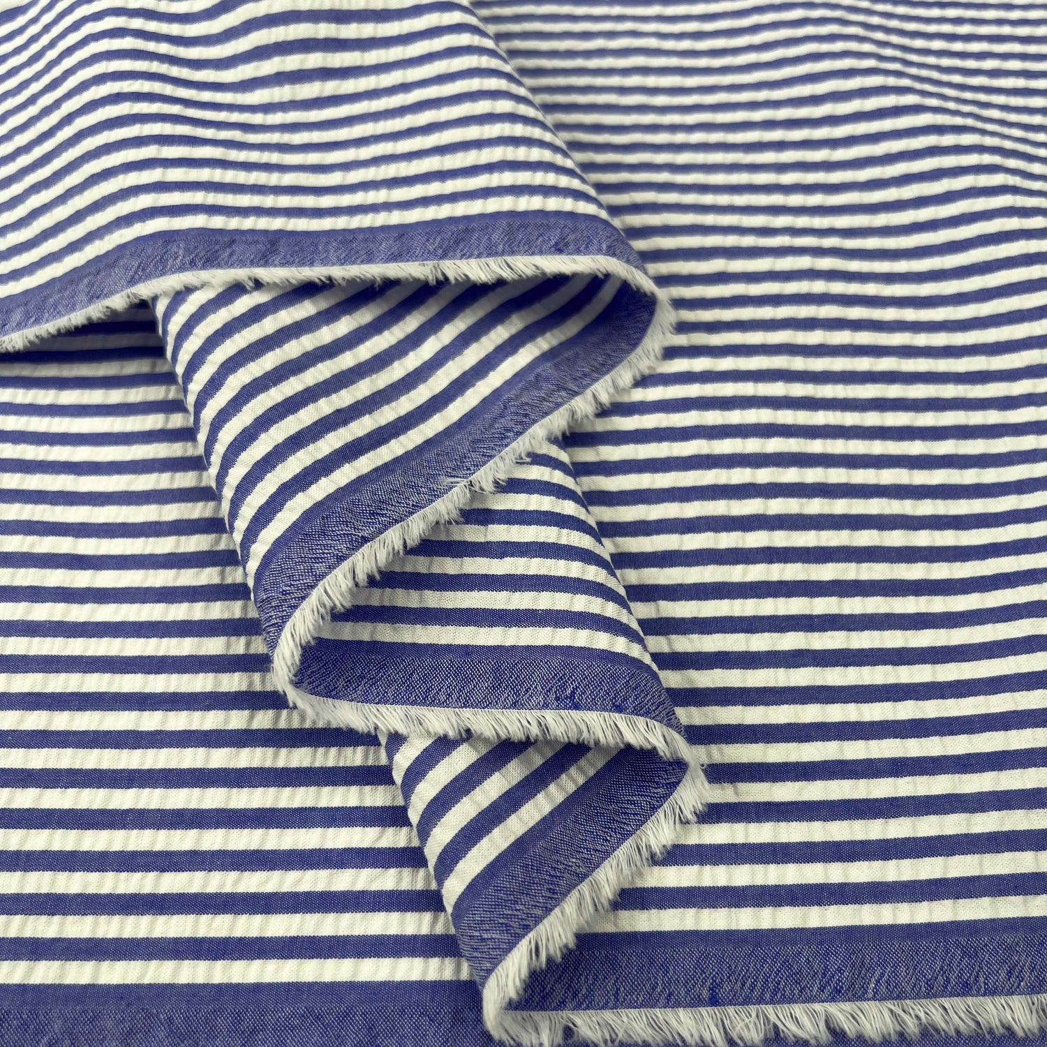 Seersucker - Henley - Blue Striped Cotton Fabric Fold

