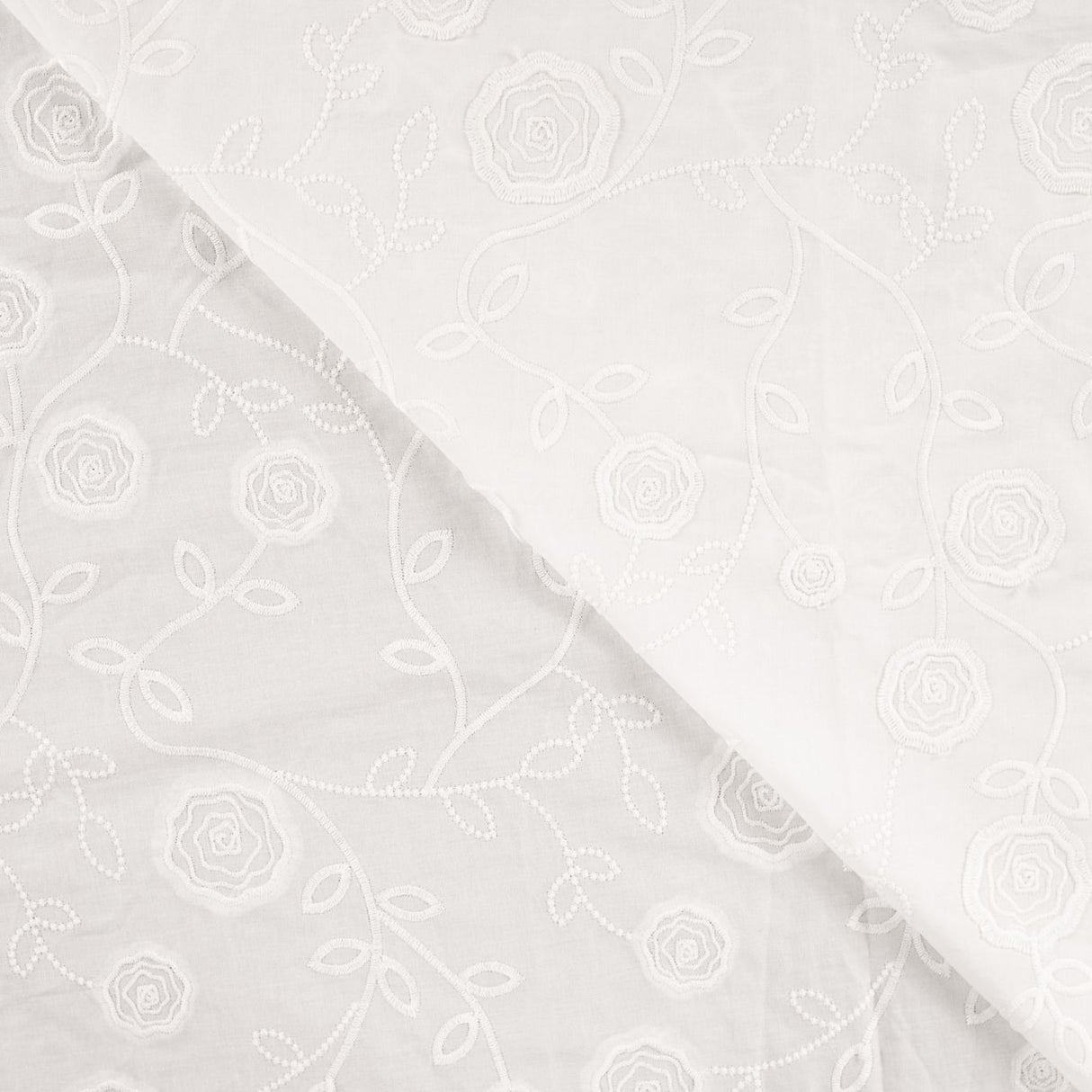 Rosalie White Embroidered Cotton Poplin 160gsm Dress Fabric Fold
