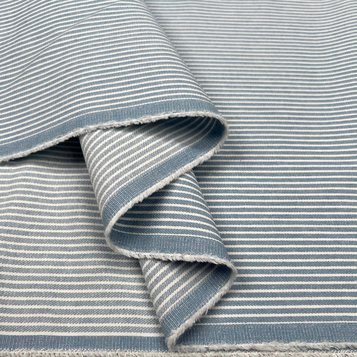Skyline Denim Cotton Blue White Stripe Lightweight Woven Fabric Fold