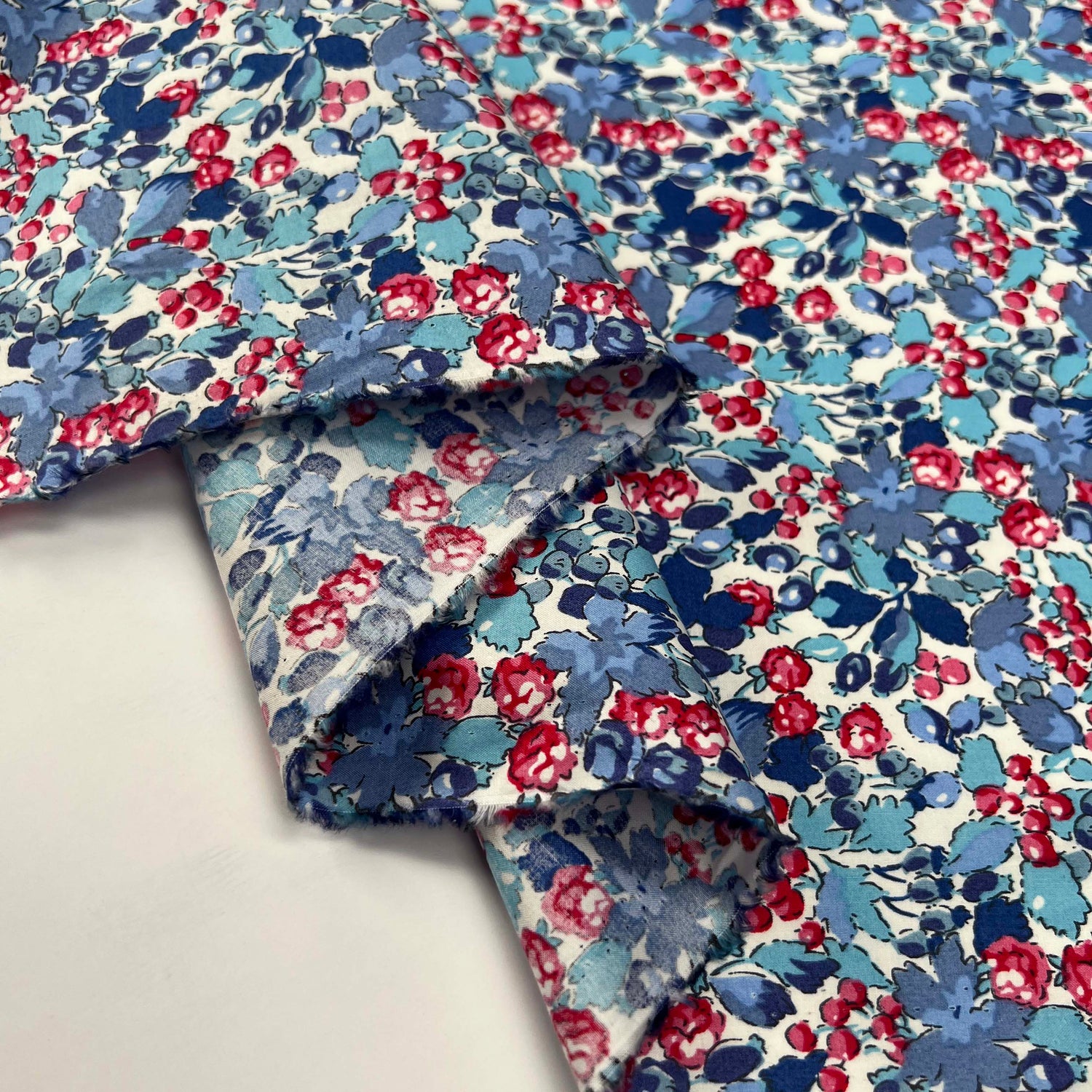 Sussex Cotton Lawn Berry Blossom Breeze Blue Red Floral Dress Fabric Fold