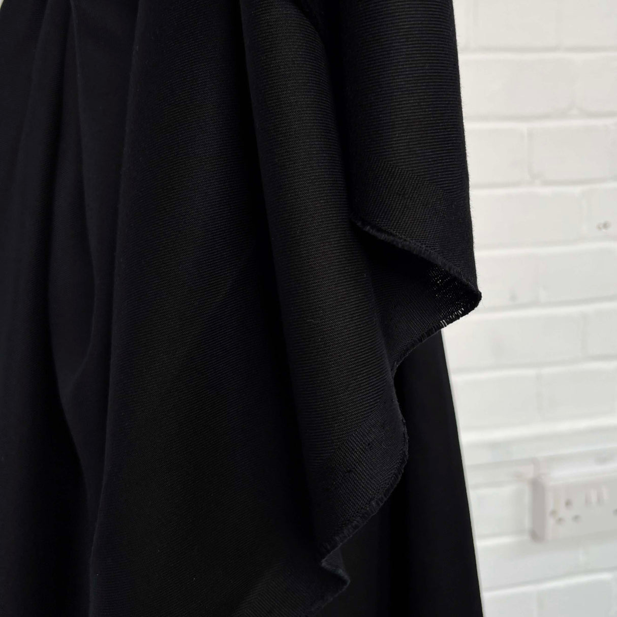 Tencel Tilliti Black Twill 250gsm Suiting Fabric Hang