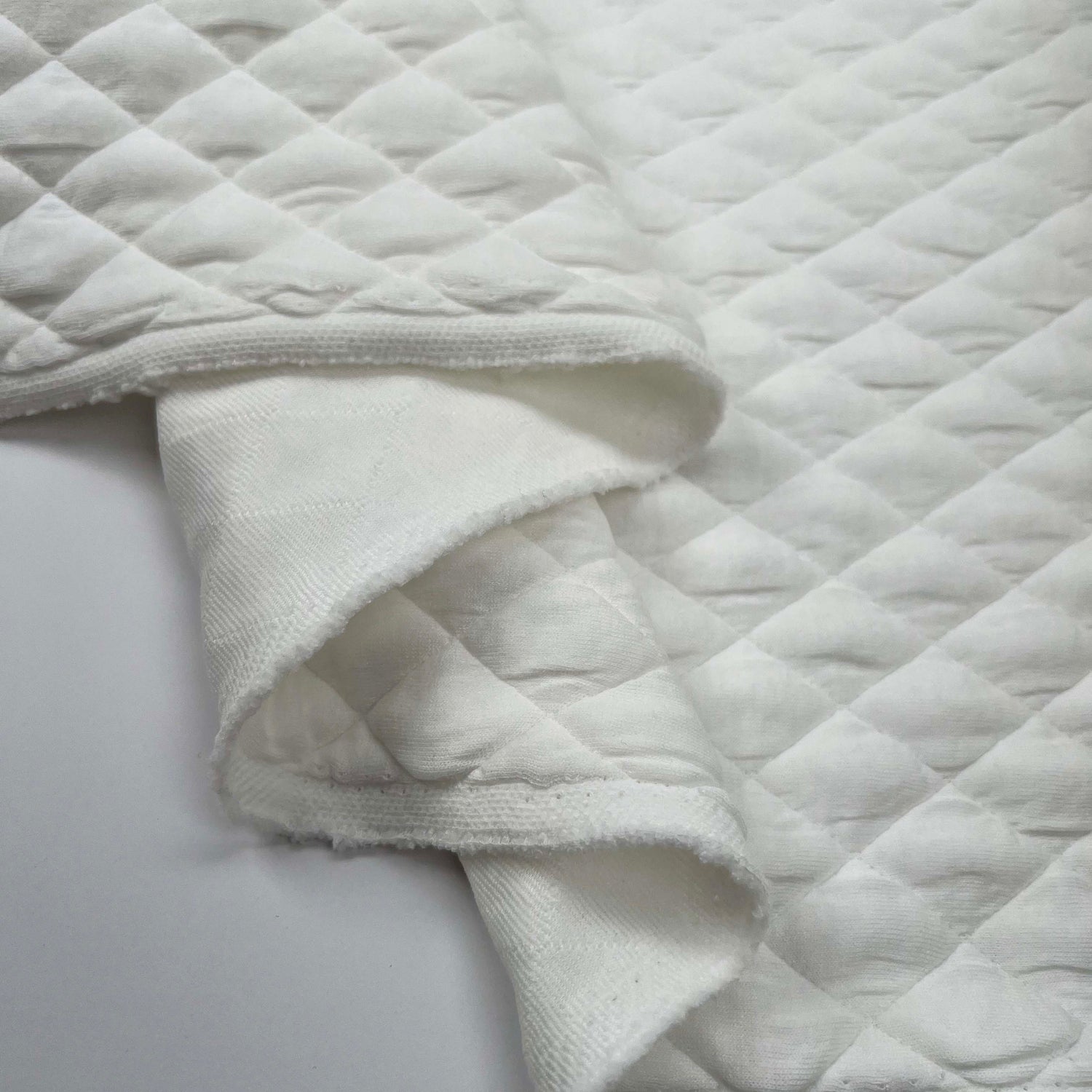 Urban Quilted Jersey Ivory Polyester Viscose Elastane Knitted Diamond Quilt Fabric Fold